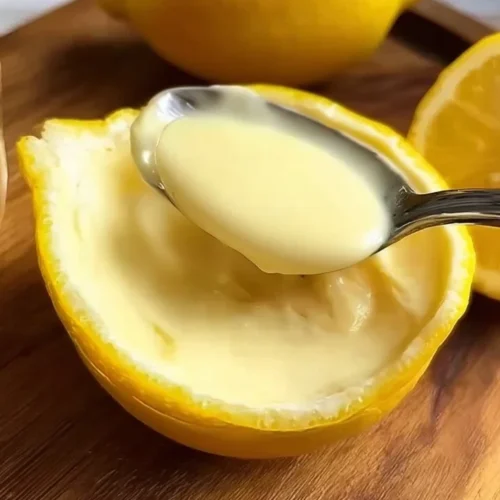 Delicious homemade Lemon Posset dessert served in glass bowl.