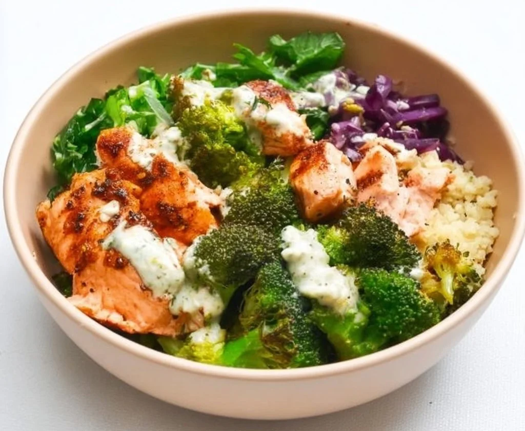 Mediterranean Salmon Bowl with fresh vegetables and herbs served in a decorative dish