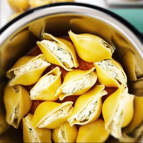 Delicious instant pot pasta dish served in a bowl with fresh herbs.