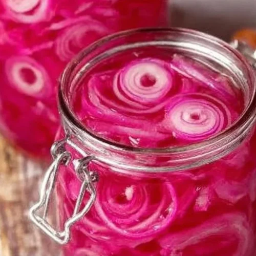 Homemade quick pickled red onions in a jar