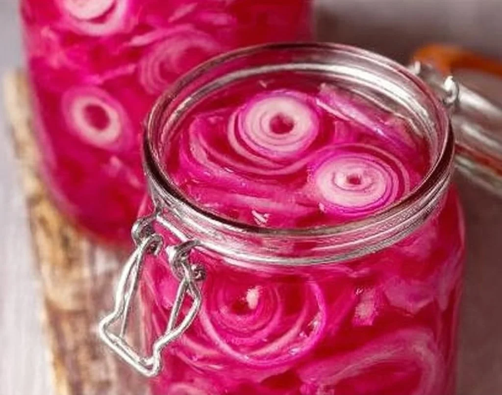 Homemade quick pickled red onions in a jar