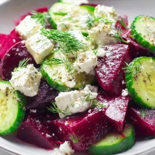 A colorful and refreshing salad with fresh vegetables and greens