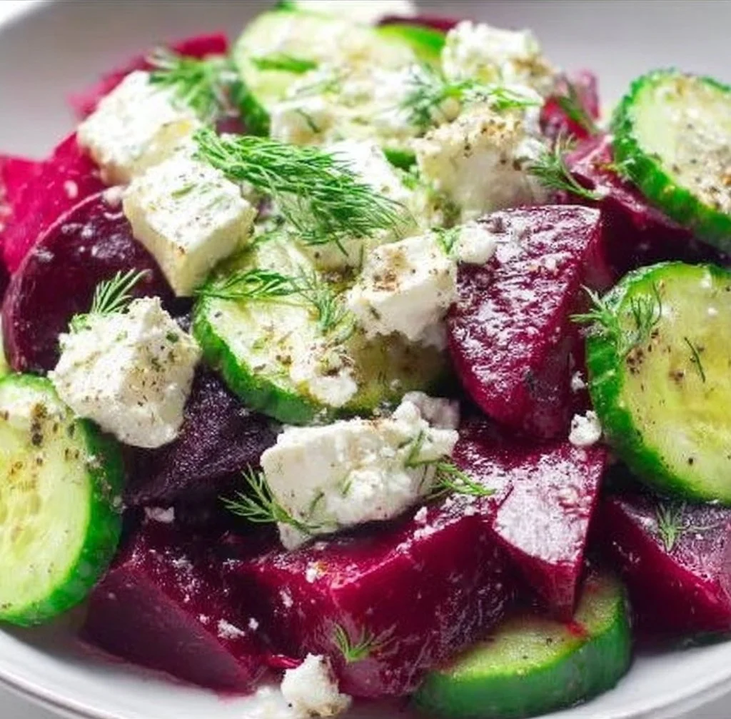 A colorful and refreshing salad with fresh vegetables and greens