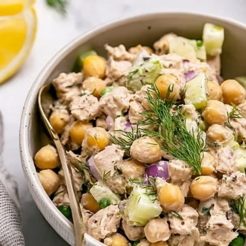 A bowl of simple Tuna Garbanzo Bean Salad with fresh ingredients