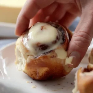 Freshly baked small batch cinnamon rolls drizzled with icing