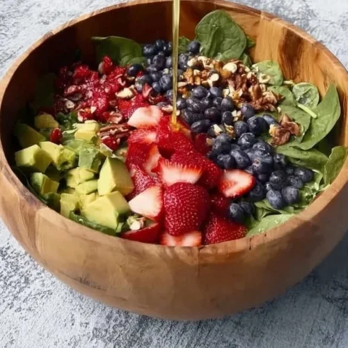 Colorful anti-inflammatory spring salad with fresh vegetables and herbs