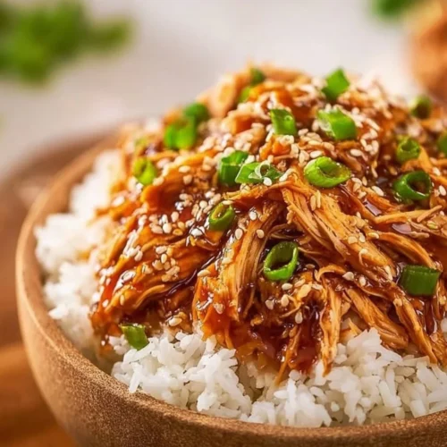 Delicious Asian Crock Pot Teriyaki Chicken served with rice and vegetables