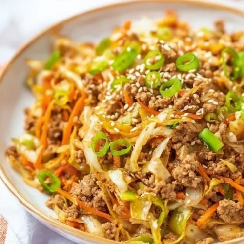 Delicious Chicken Egg Roll Bowl with fresh veggies and savory chicken.