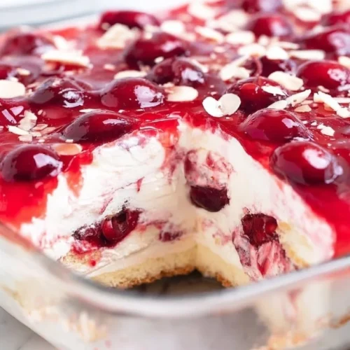 Slice of Heaven on Earth Cake with layers of cream and fruit