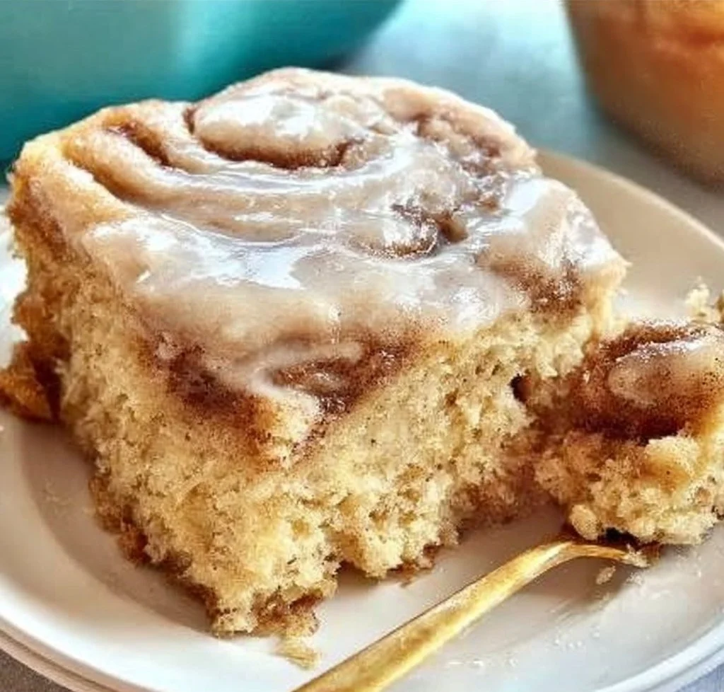 Homemade cinnamon roll cake with icing and cinnamon swirl topping