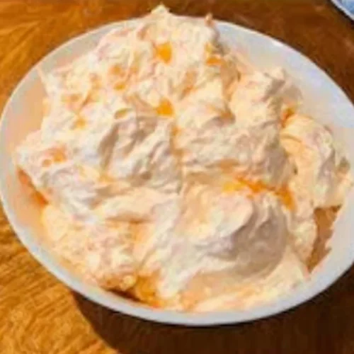 Delicious Mandarin Orange Jello Salad served in a bowl