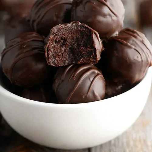 No-Bake Keto Brownie Truffles on a white plate