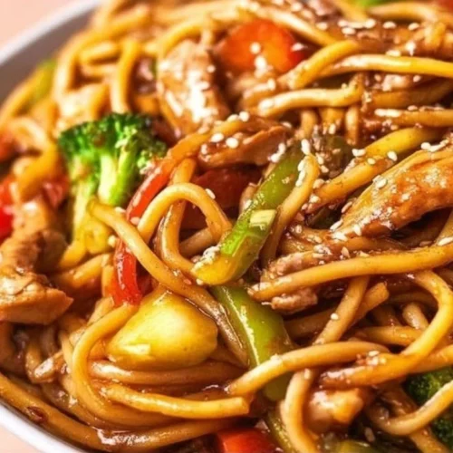 Delicious Slow Cooker Chicken Lo Mein served in a bowl with colorful vegetables