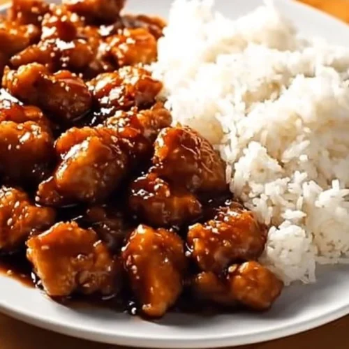 Slow Cooker General Tso's Chicken with vegetables served in a bowl
