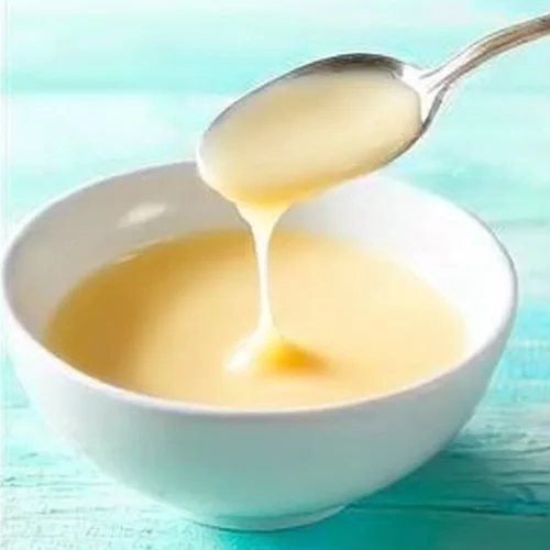 Bowl of sugar free condensed milk on a kitchen counter