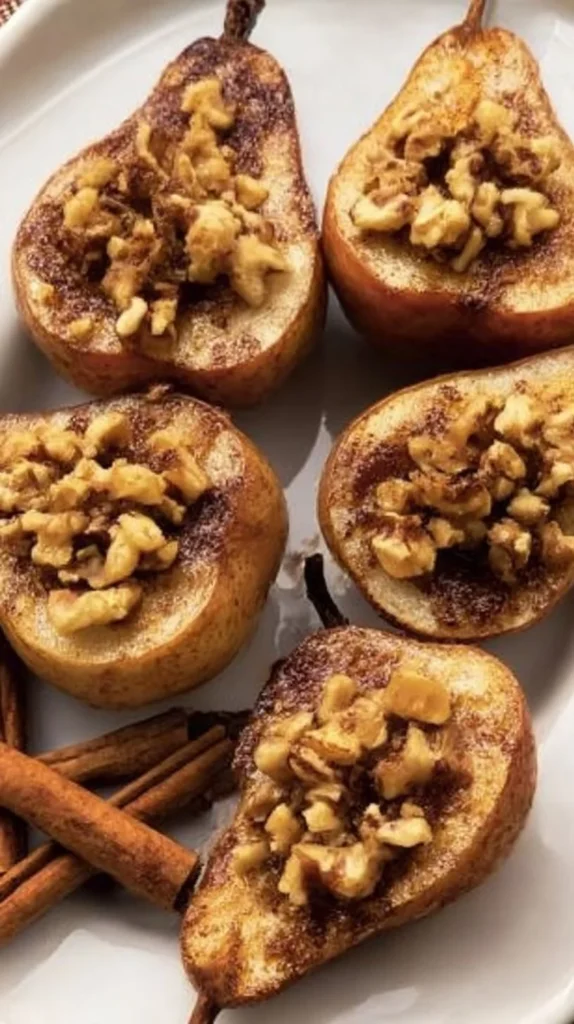 Deliciously baked pears topped with walnuts, perfect for dessert.