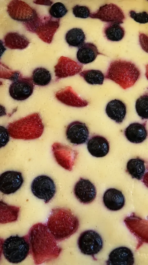 A serving of delicious baked yogurt topped with fresh fruits and nuts
