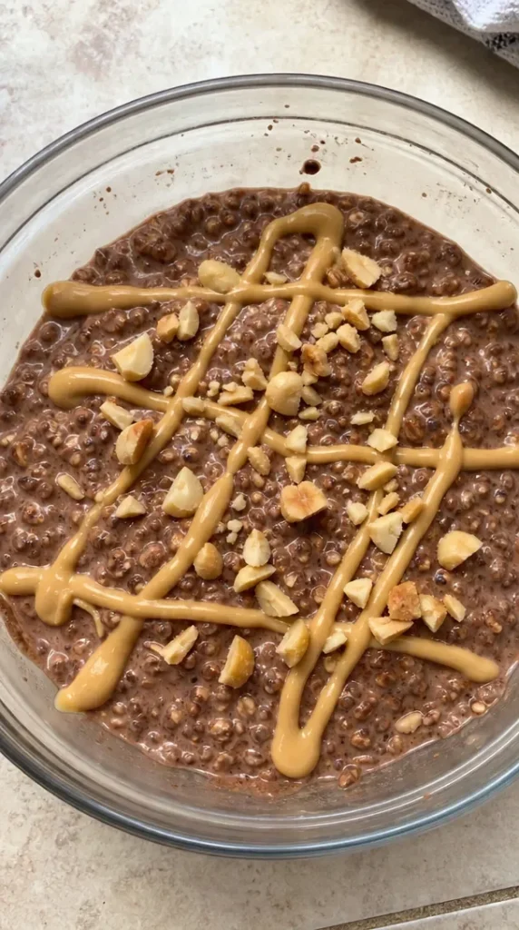 A bowl of the best overnight oats topped with fruits and seeds.